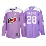 Camiseta Hockey Hombre Autentico Carolina Hurricanes 28 Elias Lindholm Hockey Fights Cancer 2018 Violeta